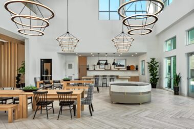 interior lobby shot with natural lighting benches booths lanterns and open window design