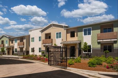 exterior of Lark Apartments at Coper river with a colorful sunny day