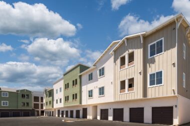 row of apartment buildings on a sunny day